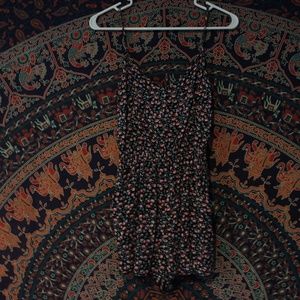 Black Floral Romper with Cross-Pattern Back Cutout